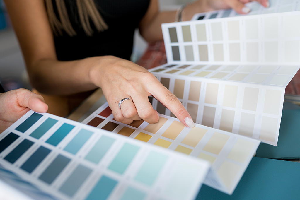 Women holding paint swatches